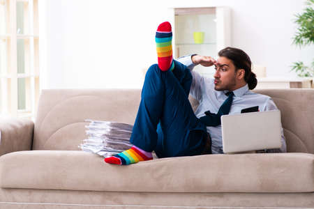 Young male businessman working at homeの写真素材