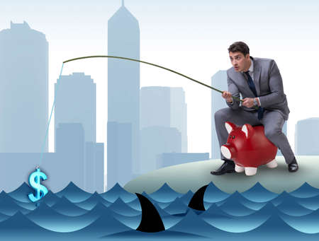 Businessman fishing out dollars from waterの写真素材