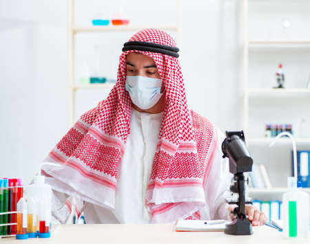 Arab chemist working in the lab officeの写真素材