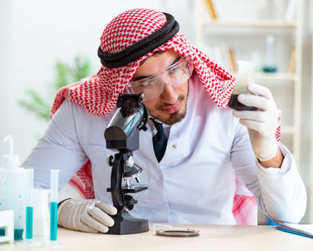 Arab chemist working in the lab officeの写真素材