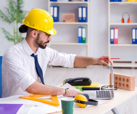 Architect working in his studio on new projectの写真素材