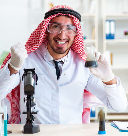 Arab chemist working in the lab officeの写真素材