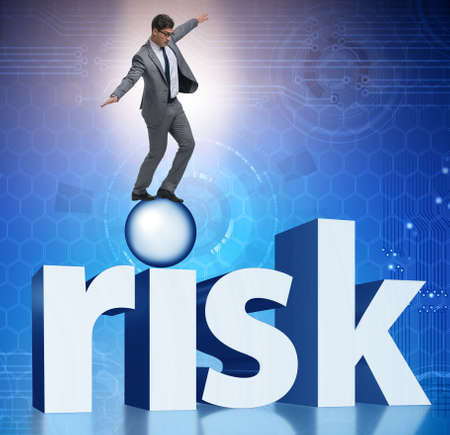 Young businessman in business risk and uncertainty conceptの写真素材