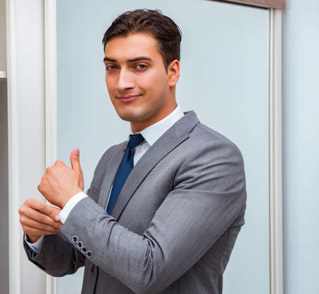 Businessman dressing up for workの写真素材