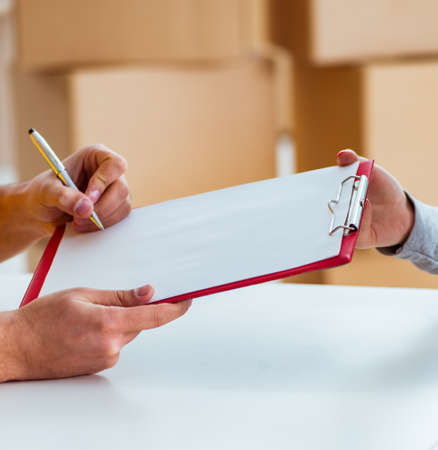 The delivery man delivering parcel box