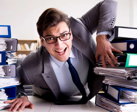 Businessman under stress due to excessive work
