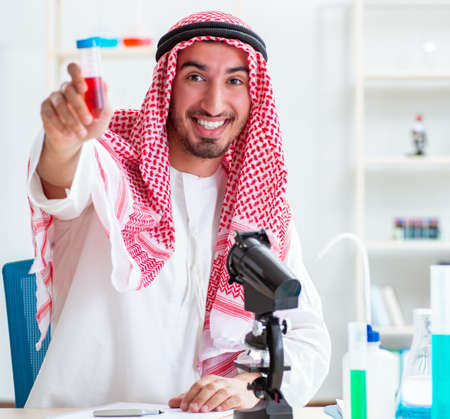 Arab chemist working in the lab officeの写真素材