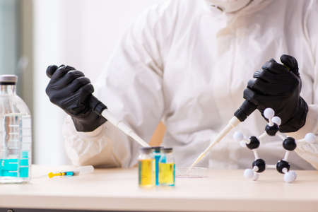 Doctor working in lab in coronavirus COVID-19 concept