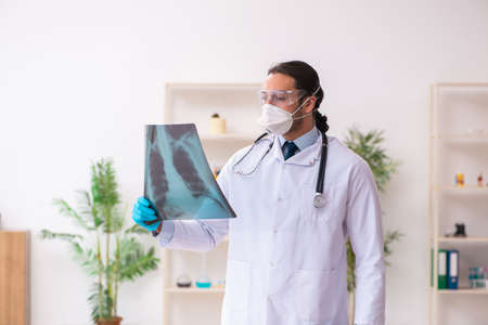 Doctor working in lab in coronavirus COVID-19 conceptの写真素材