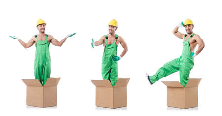 Man in coveralls with boxesの写真素材