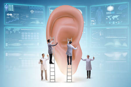 The doctor examining giant ear in medical conceptの写真素材