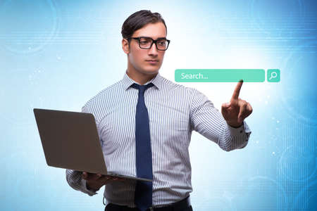 Search concept with businessman pressing buttonの写真素材