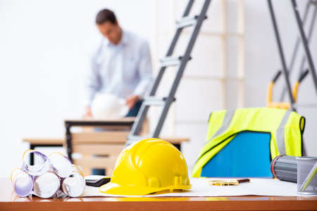 Young male architect working indoors on projectの写真素材