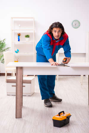 Young male carpenter working indoorsの写真素材