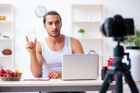 Young male blogger in dieting conceptの写真素材