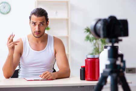 Young male blogger in dieting conceptの写真素材