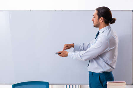 Young male employee in business presentation conceptの写真素材