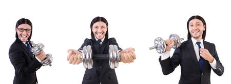 Young businessman holding barbell isolated on whiteの写真素材