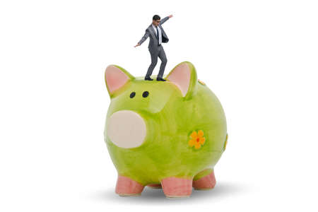Businessman in debt concept with piggybankの写真素材