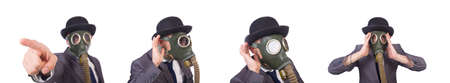 The businessman wearing gas mask isolated on whiteの写真素材
