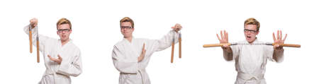 Funny karate fighter with nunchucks on whiteの写真素材