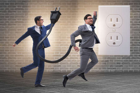 Businessman losing energy to workの写真素材