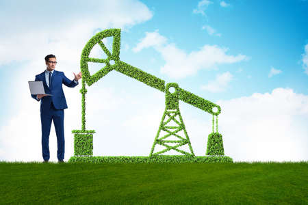 Businessman and green oil energy conceptの写真素材