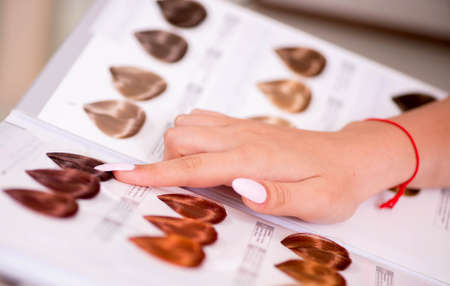 Customer choosing colour for her hairの写真素材