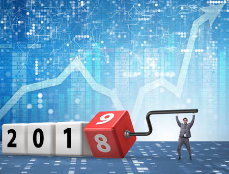 Businessman employee rotating cube to reveal number 2019