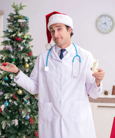 Doctor with gift box in the hospitalの写真素材