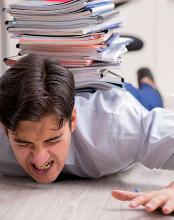 Extremely busy employee working in the office