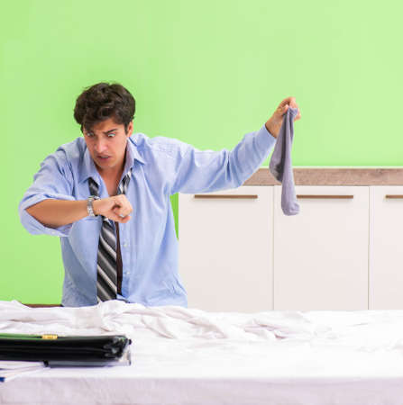 Young businessman employee late for officeの写真素材