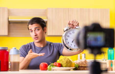 Young man blogging about food supplementsの写真素材