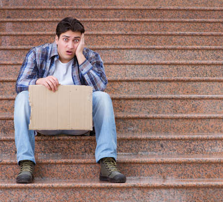 Young man begging money on the street