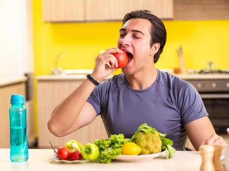 Young man in dieting and healthy eating conceptの写真素材