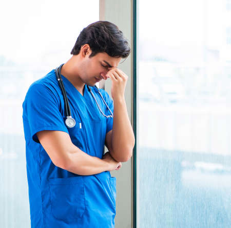 Young handsome doctor working in the hospitalの写真素材