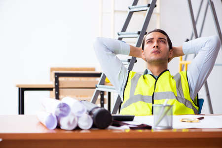 Young male architect working indoors