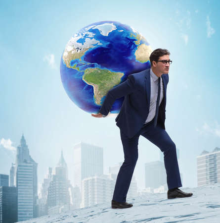 Businessman carrying Earth on his shouldersの写真素材