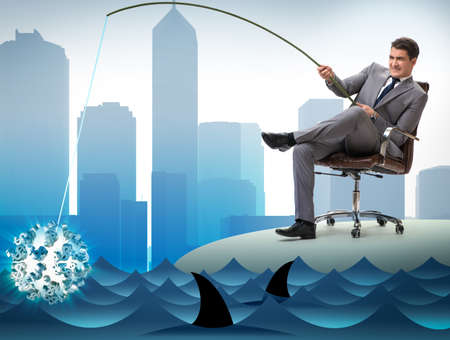 Businessman fishing out dollars from waterの写真素材