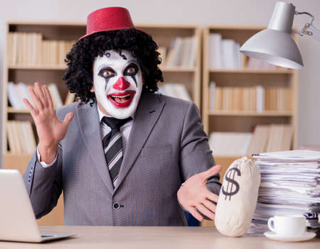 Clown businessman working in the officeの写真素材