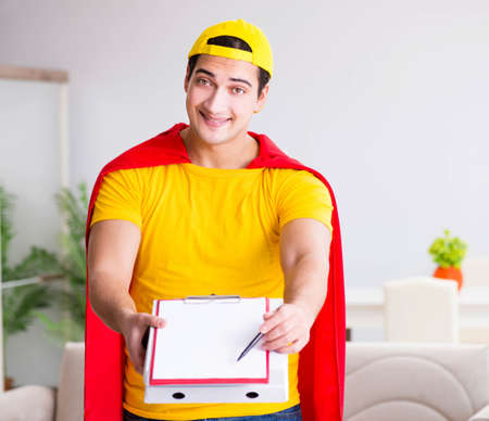 Superhero pizza delivery guy with red coverの写真素材