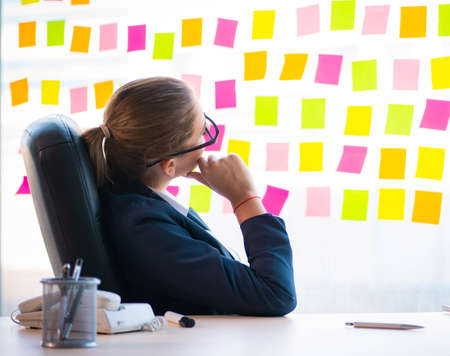 Beautiful female employee with many conflicting prioritiesの写真素材