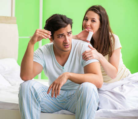 Man using pills for woman satisfactionの写真素材