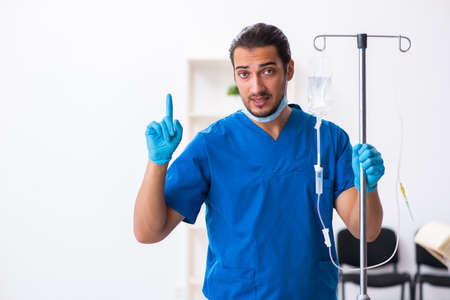Young male doctor working in the clinicの写真素材