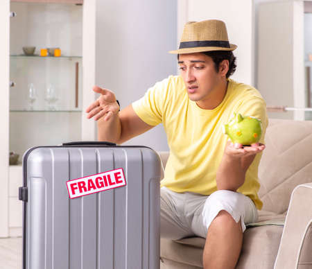 Man going on vacation with fragile suitcasesの写真素材