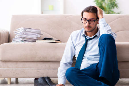 Young male businessman working at homeの写真素材