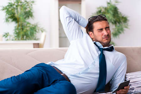 Young male businessman working at homeの写真素材