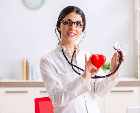 Young doctor in heart care concept