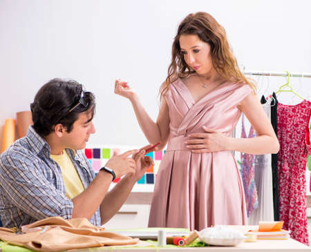Young tailor working in his workshopの写真素材