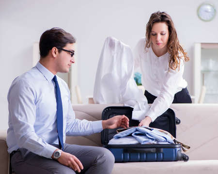 Wife seeing her husband off to business tripの写真素材